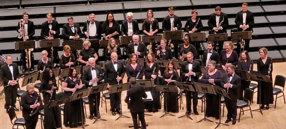 The Clarinet Choir standing in formal black on the Carnegie Hall stage